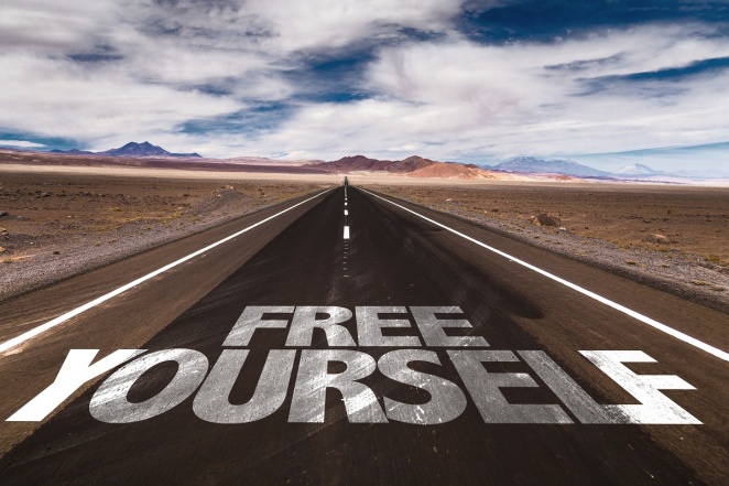 Free Yourself written on desert road